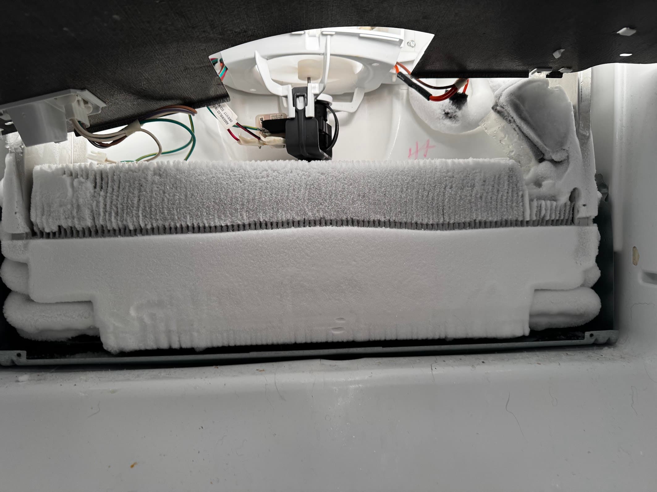 Frozen evaporator coils before defrost repair service