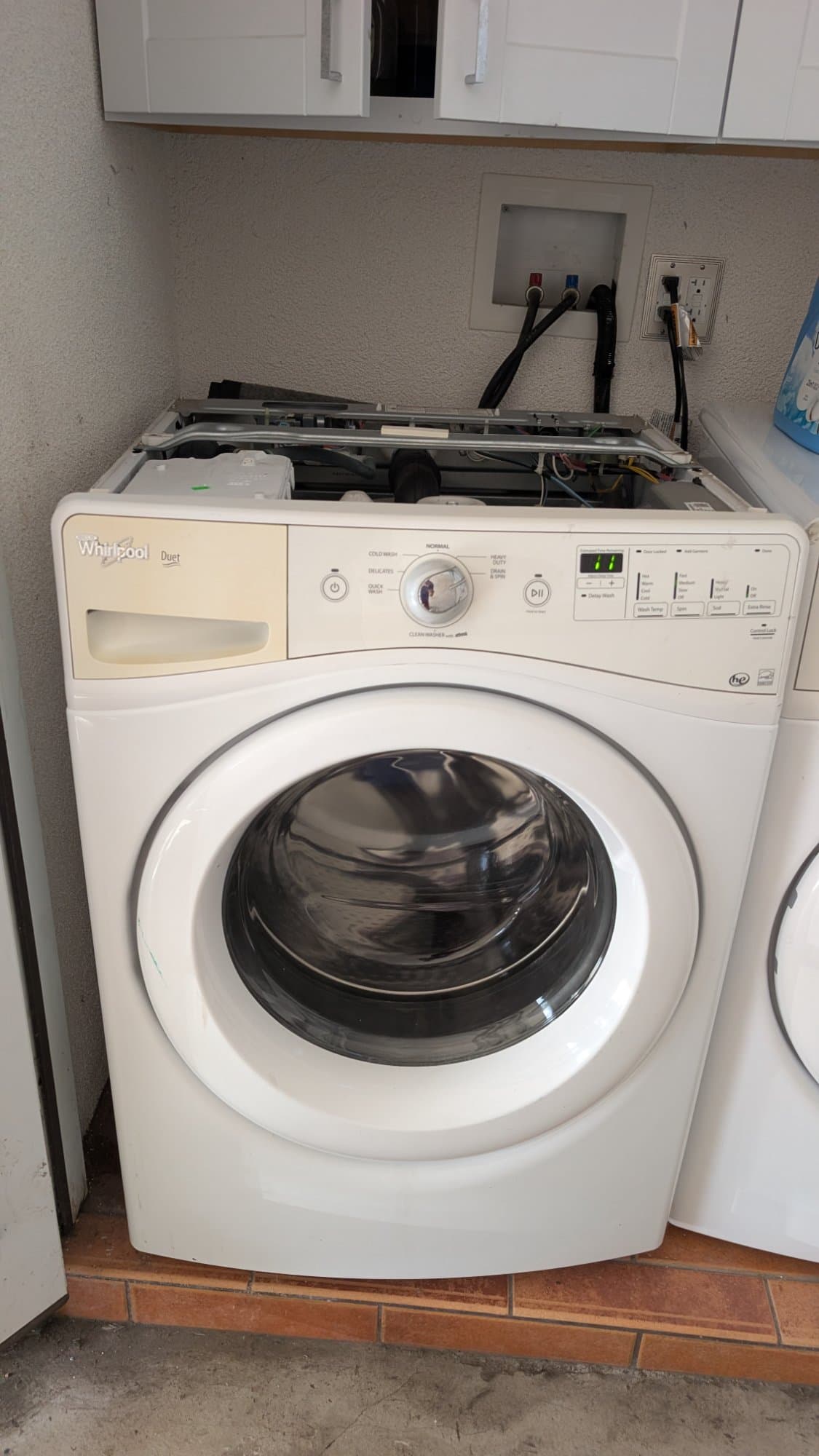 Whirlpool Duet washer being diagnosed with top panel removed